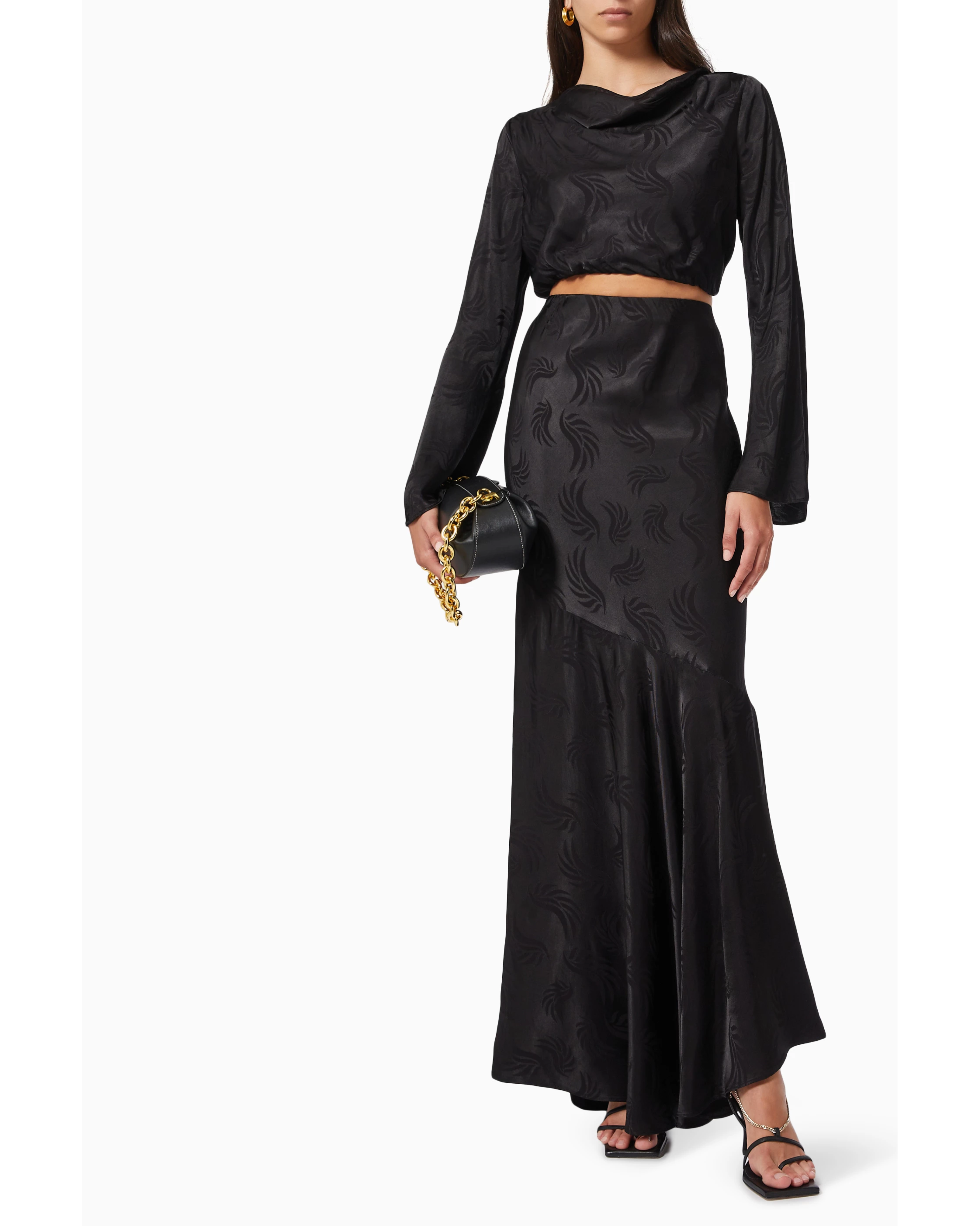 Black satin co-ord set with long sleeve crop top and maxi skirt featuring swirl pattern — Significant Other | Endless UAE