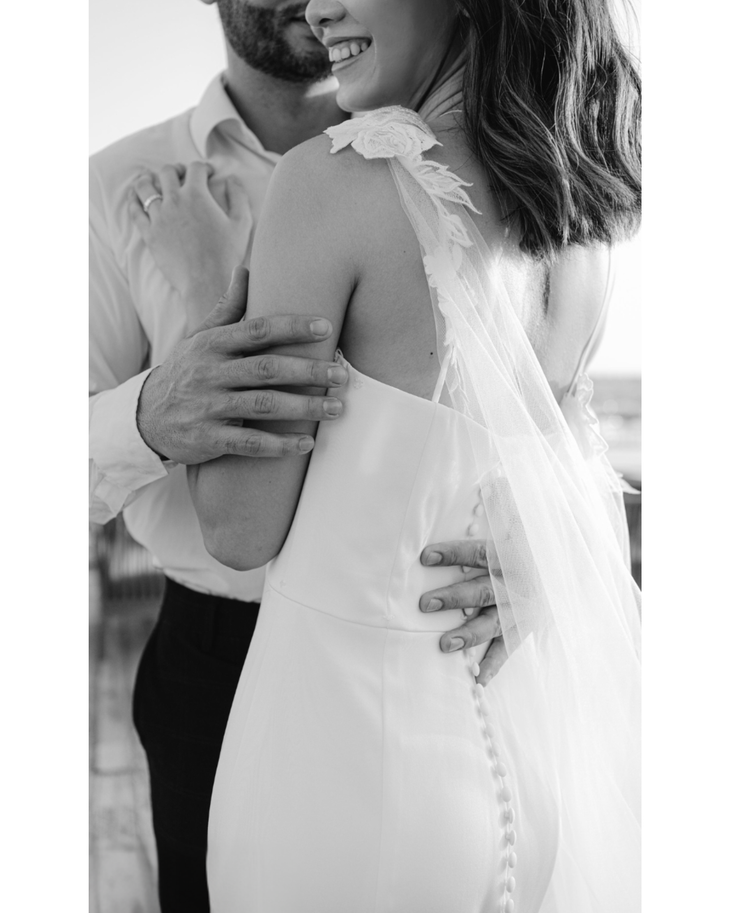 Bride in white convertible wedding dress with floral embellishments and flowing train — Dressarte Paris | Endless UAE
