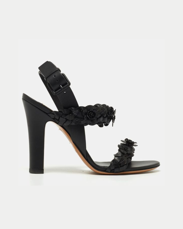 Black leather heeled sandals with floral appliqué straps and adjustable ankle buckle — Valentino Garavani | Endless UAE
