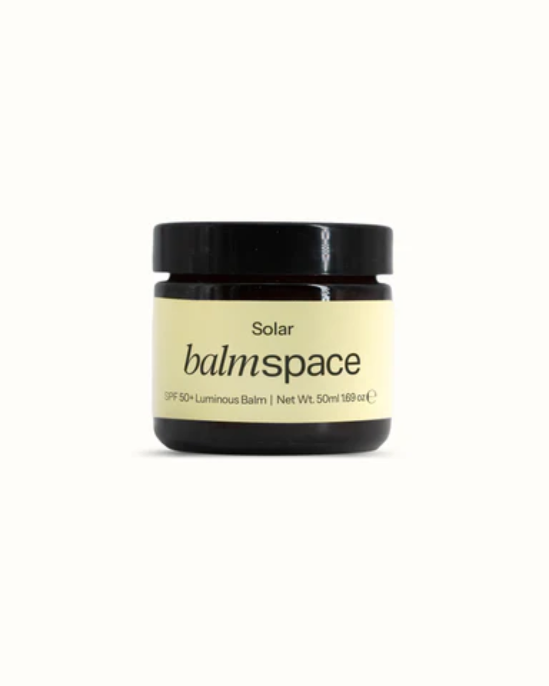 SPF 50+ luminous face balm in dark glass jar with black lid and cream label — Balm Space | Endless UAE