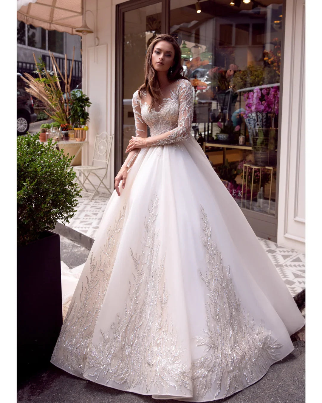Elegant white wedding dress with beaded lace bodice and flowing ball gown skirt — Mar©a Anette | Endless UAE