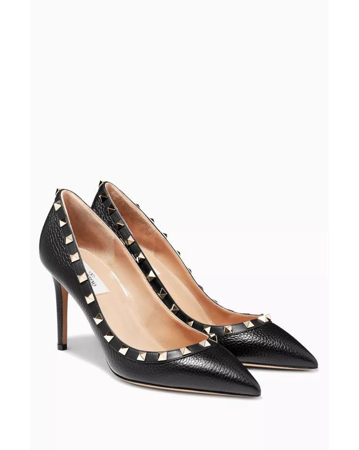 Black leather pointed-toe pumps with signature gold rockstud trim — Valentino Garavani | Endless UAE