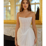 Strapless white mini dress with pearl-embellished bodice and asymmetric tulle drape detail — Rosie Etienne | Endless UAE