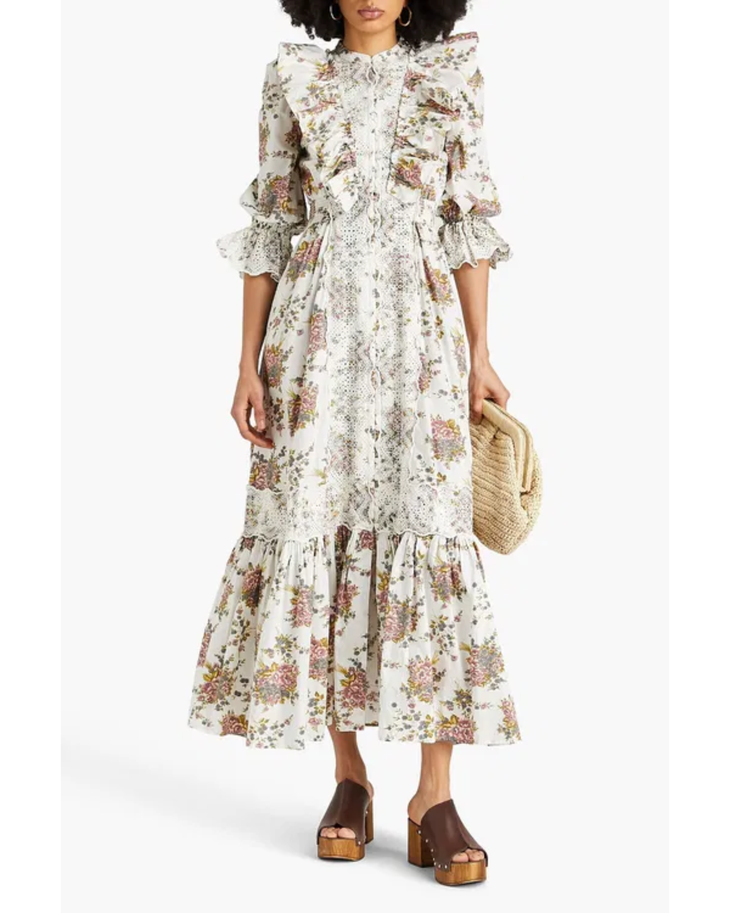 Woman wearing a cream floral ruffled cotton maxi dress with puff sleeves — Bytimo | Endless UAE
