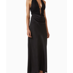 Woman wearing black halter maxi dress with ruched waist detail and silver accent — Misha | Endless UAE