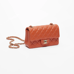 Coral quilted lambskin mini classic handbag with gold CC logo — Chanel | Endless UAE