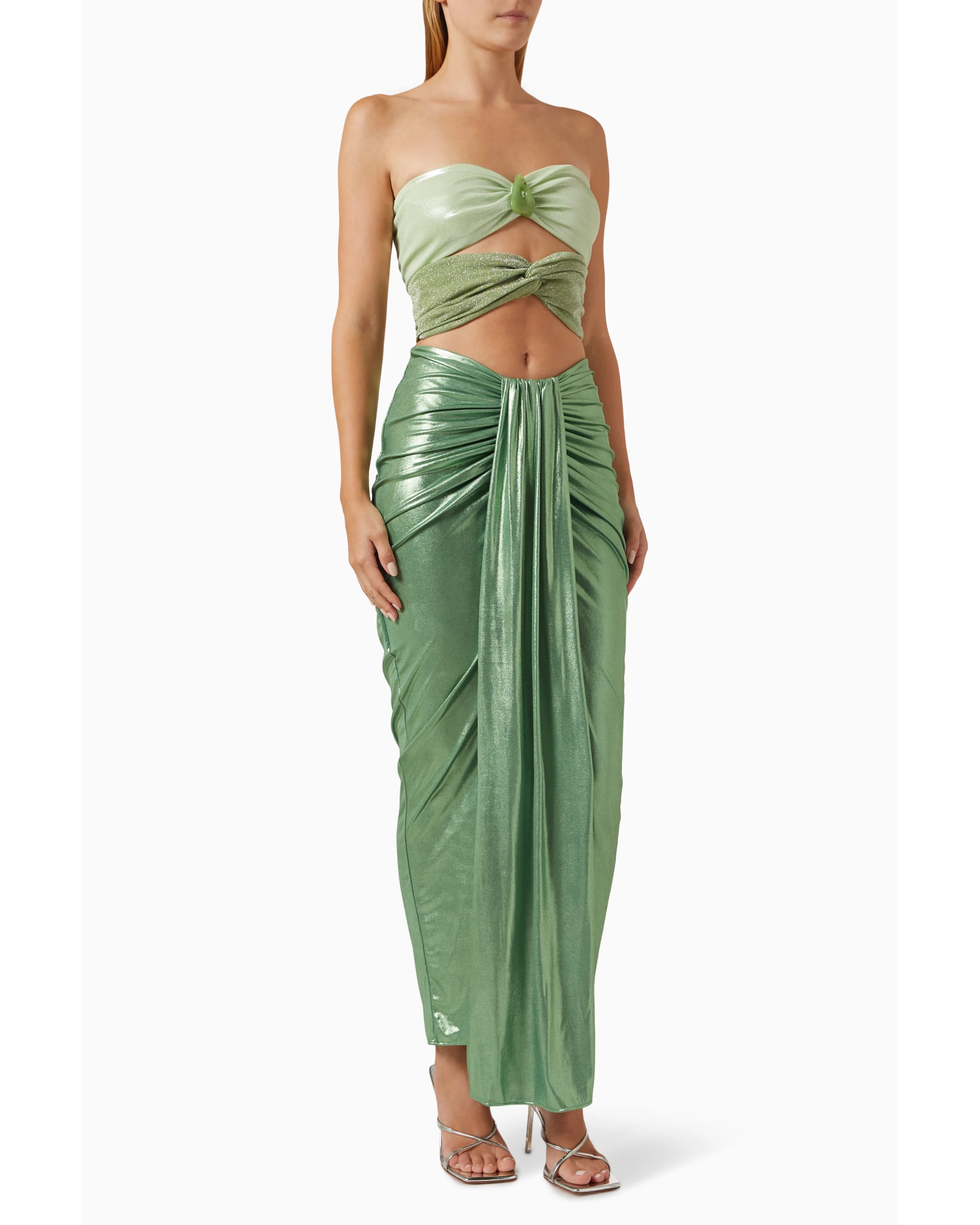 Woman wearing sage green ruched cutout maxi dress with metallic finish and strappy sandals — Baobab | Endless UAE