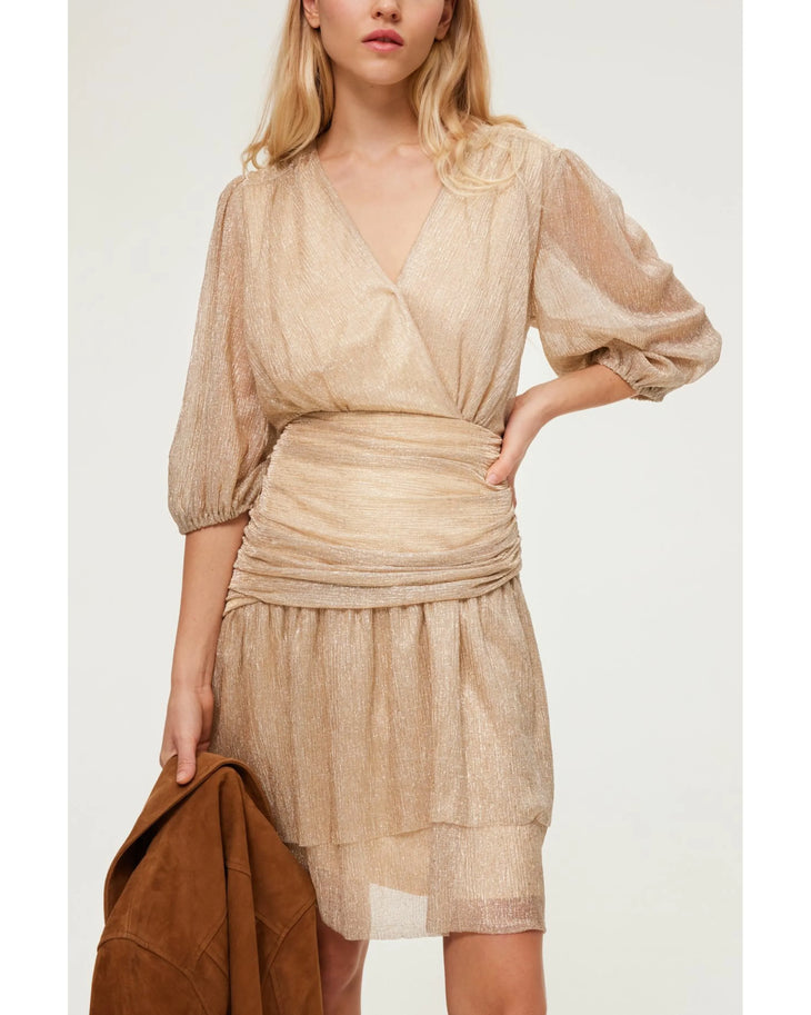 Woman wearing beige wrap dress with ruched waist and three-quarter sleeves — Pablo | Endless UAE