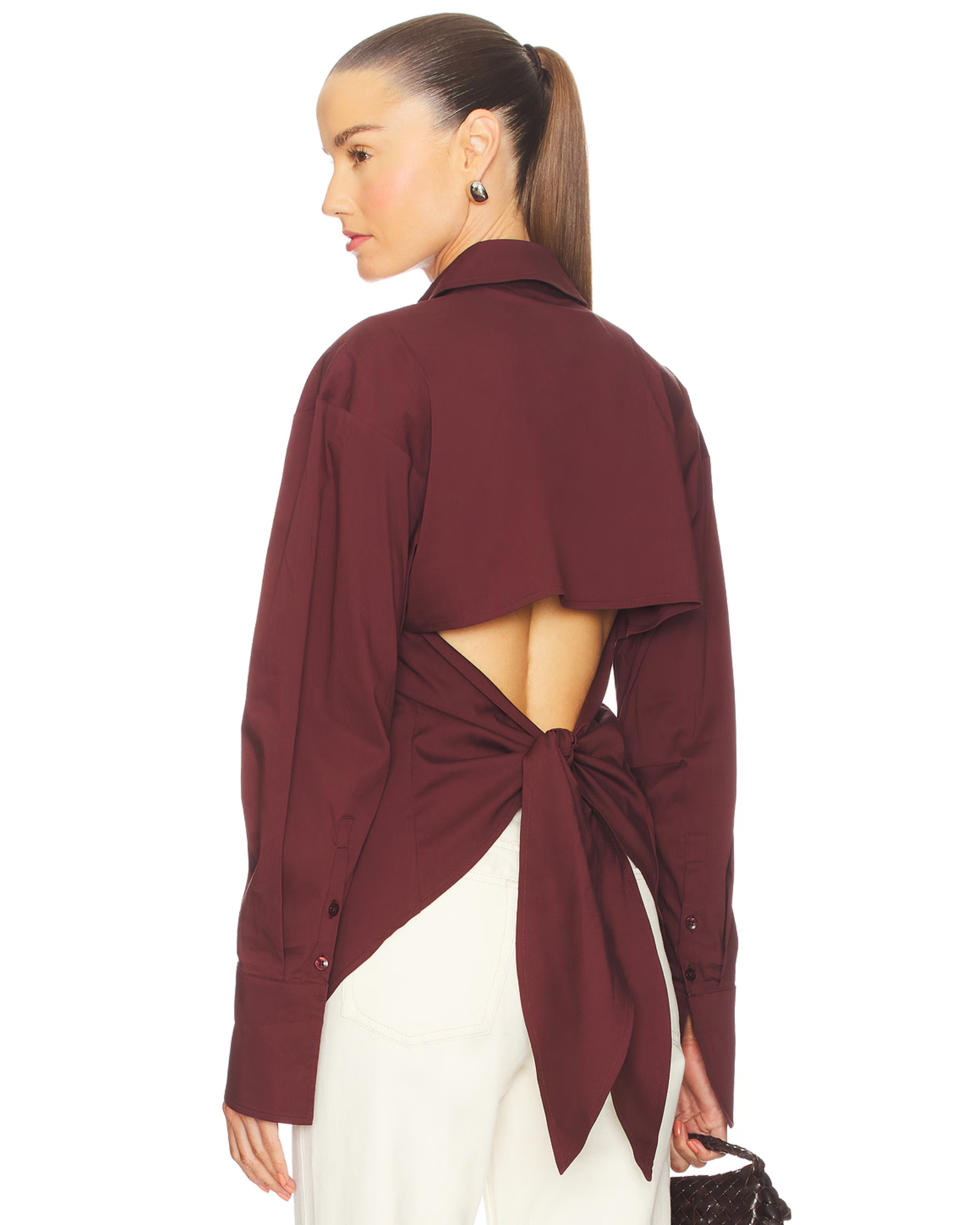 Burgundy poplin button-up shirt styled with cream trousers and black bag — Simon Miller | Endless UAE