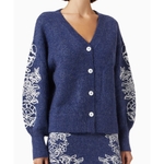 Navy blue knit cardigan with white floral embroidery on sleeves, paired with matching embroidered skirt — Aston Studio | Endless UAE