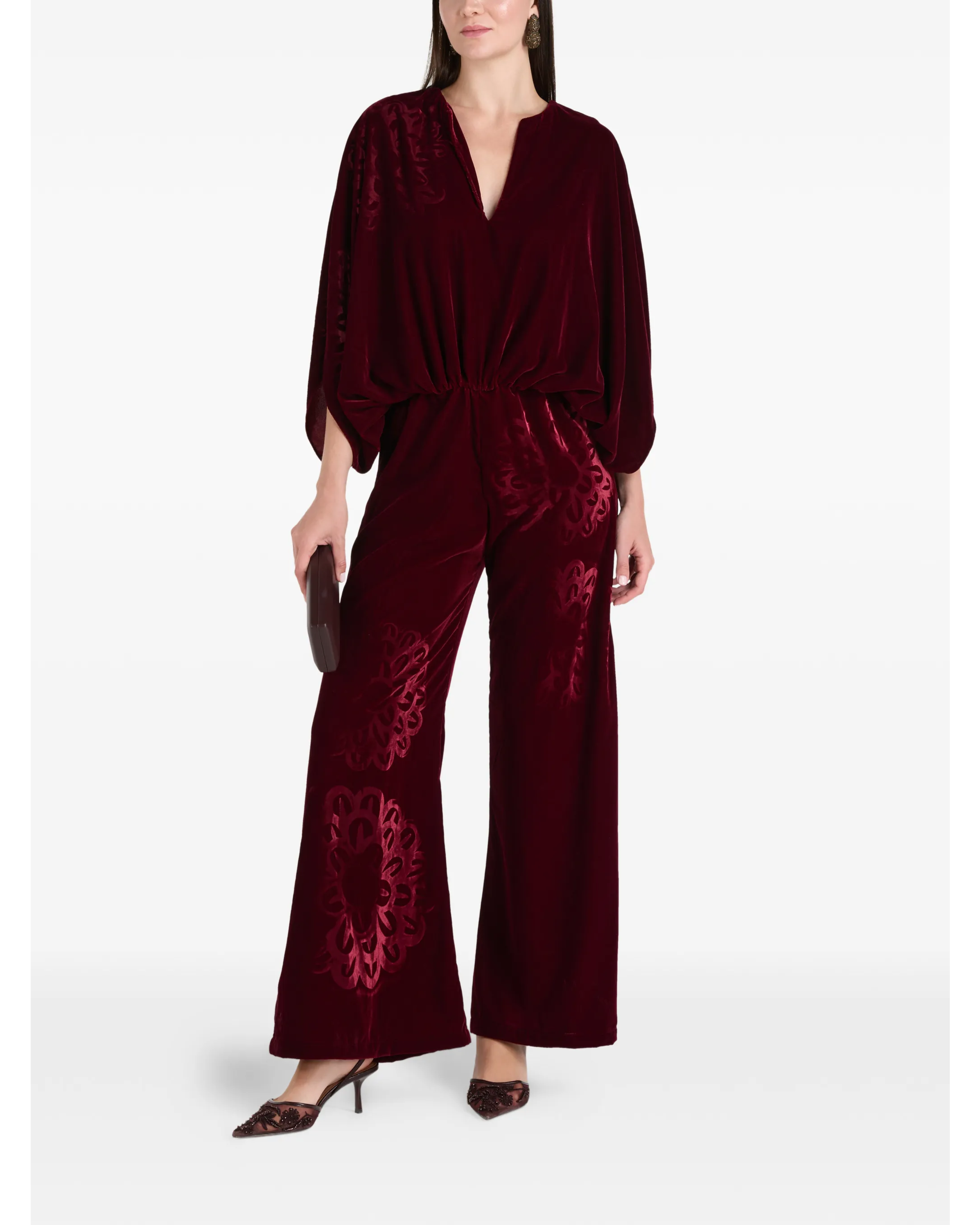 Woman wearing burgundy silk velvet jumpsuit with ornamental detailing and wide legs — Themis-Z | Endless UAE