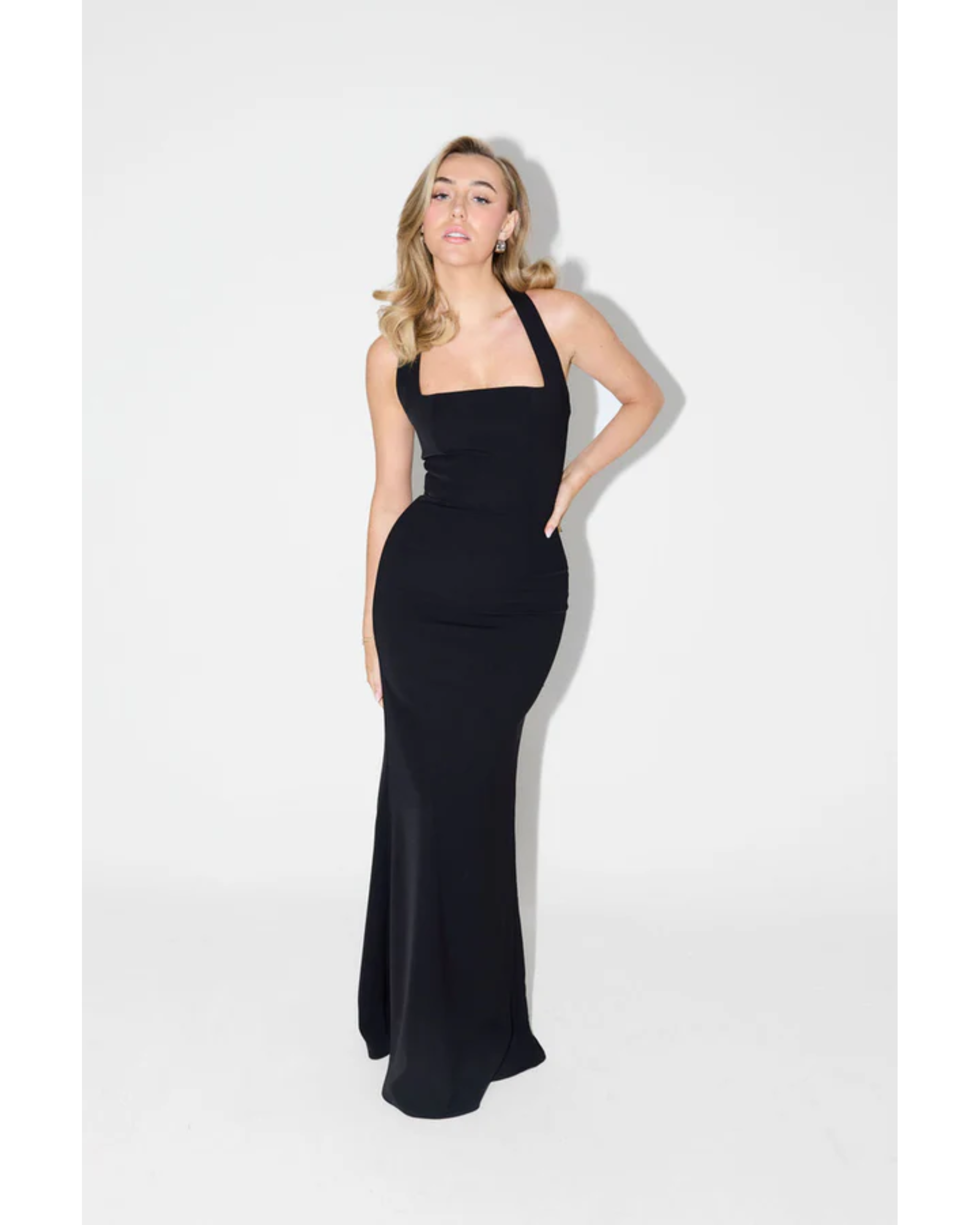 Woman wearing black halter neck maxi dress with fitted silhouette — Odd Muse | Endless UAE