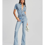 Woman wearing light blue denim Fallon Jumpsuit with short sleeves and flared legs — SER.O.YA | Endless UAE