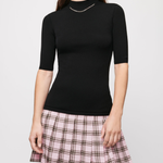 Black knit top with pink plaid wool skirt dress — Maje | Endless UAE