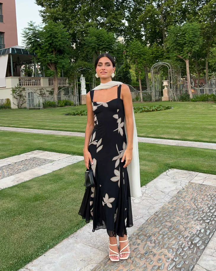 Woman wearing black Salima dress with white leaf embroidery and white shawl — Lady Pipa | Endless UAE