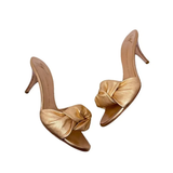 Gold twisted knot slide heels with thin stiletto heel — Giuseppe Zanotti | Endless UAE