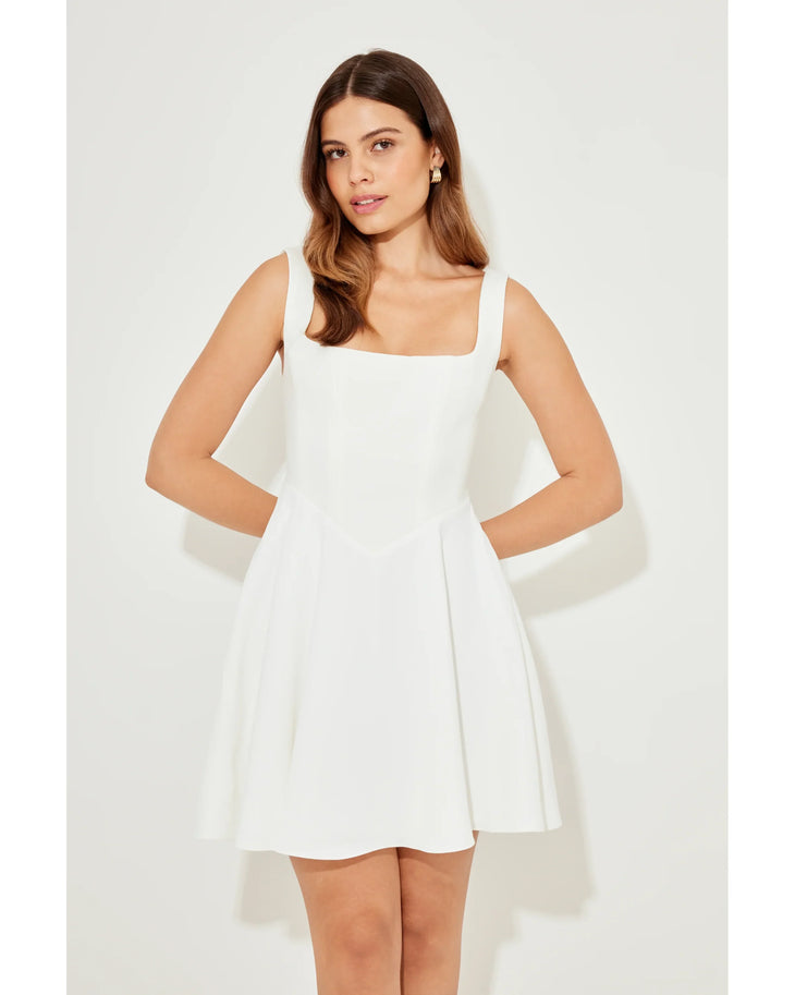 Woman wearing white sleeveless square neck mini dress with white heeled sandals — Odd Muse | Endless UAE