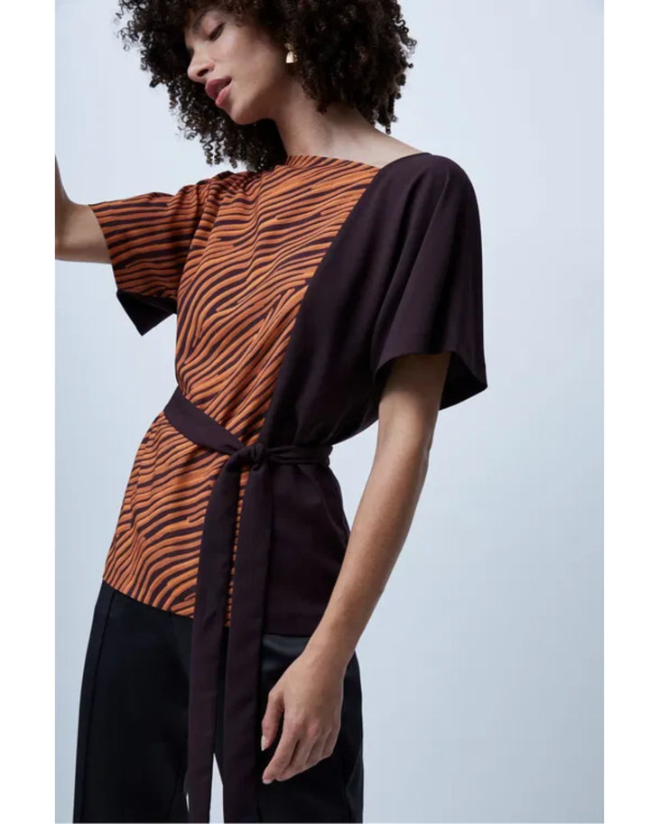 Woman wearing orange zebra stripe top with black sleeves and black cropped pants — French Connection | Endless UAE