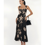 Woman wearing black Salima dress with white leaf embroidery and white shawl — Lady Pipa | Endless UAE