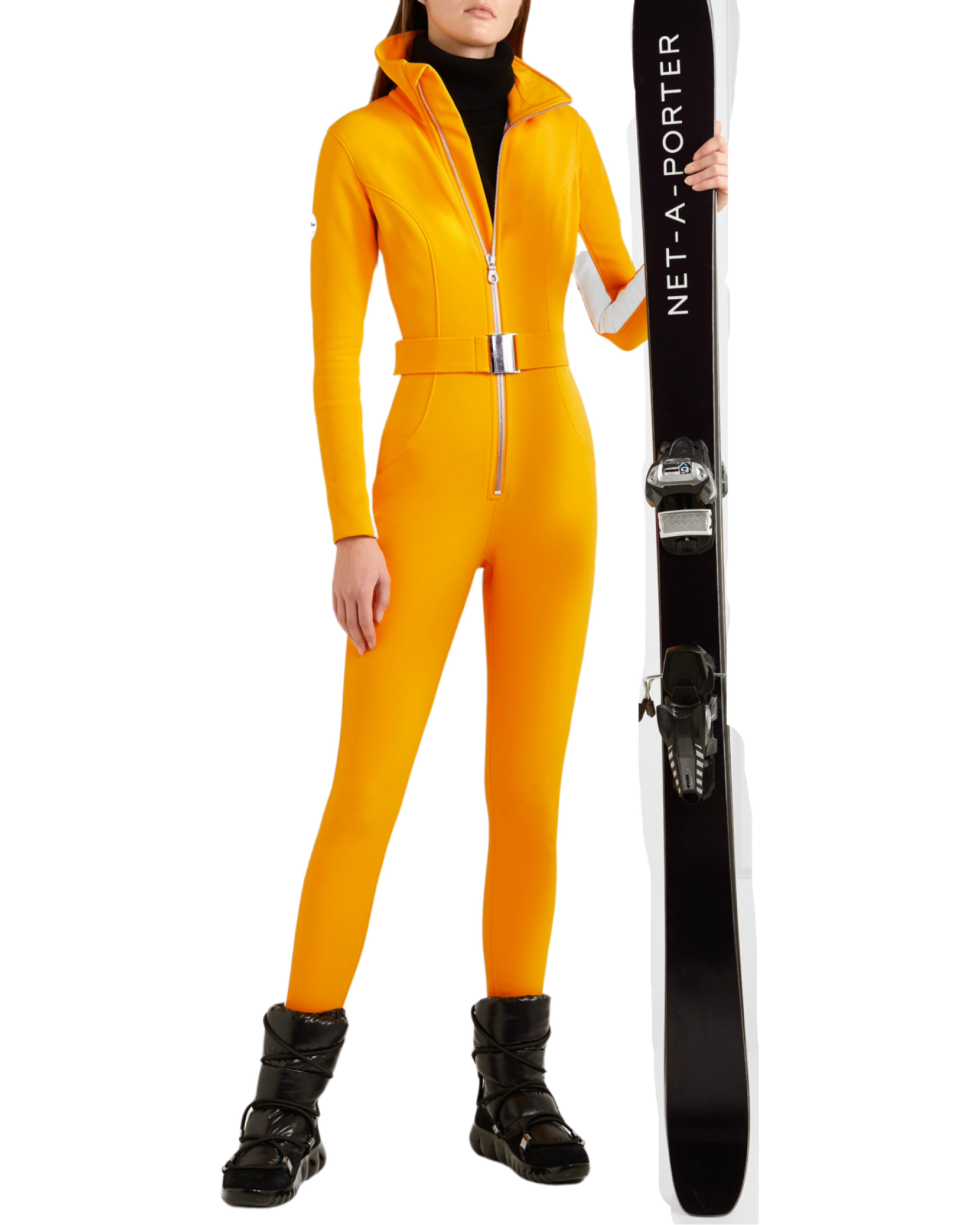 Bright yellow ski suit with belted waist and black turtleneck, paired with black skis — Cordova | Endless UAE