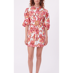 Woman wearing Explorer Mini Dress with pink floral print, puff sleeves, and gold belt — Torannce | Endless UAE