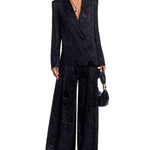 Woman wearing black leopard jacquard blazer and matching wide leg pants with accessories — Farm Rio | Endless UAE