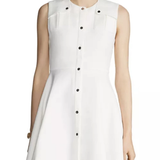 White sleeveless A-line dress with black button front closure and chest pockets — Maje | Endless UAE