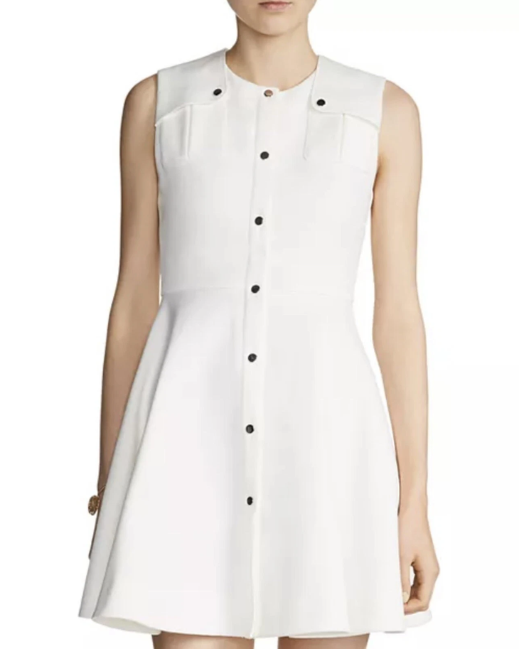 White sleeveless A-line dress with black button front closure and chest pockets — Maje | Endless UAE