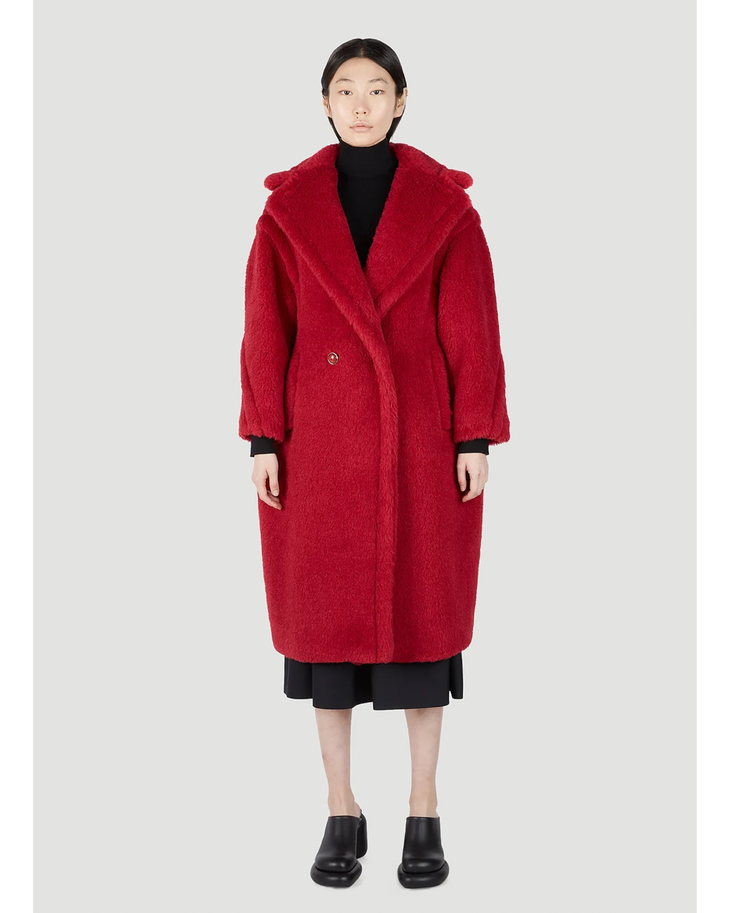 Woman wearing bright red oversized teddy bear textured coat with black turtleneck and midi skirt — Max Mara | Endless UAE