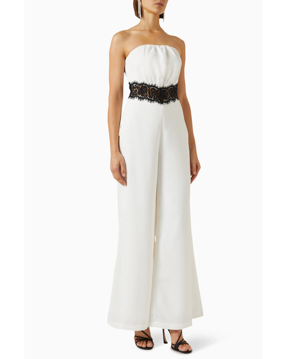 Woman wearing cream strapless jumpsuit with black lace waistband — Elle Zeitoune | Endless UAE