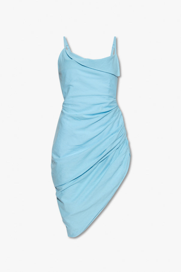 Woman wearing light blue draped mini dress with matching clutch and platform sandals — Jacquemus | Endless UAE