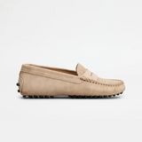 Beige suede junior driving loafer with black rubber sole and stitched detailing — Tod's | Endless UAE