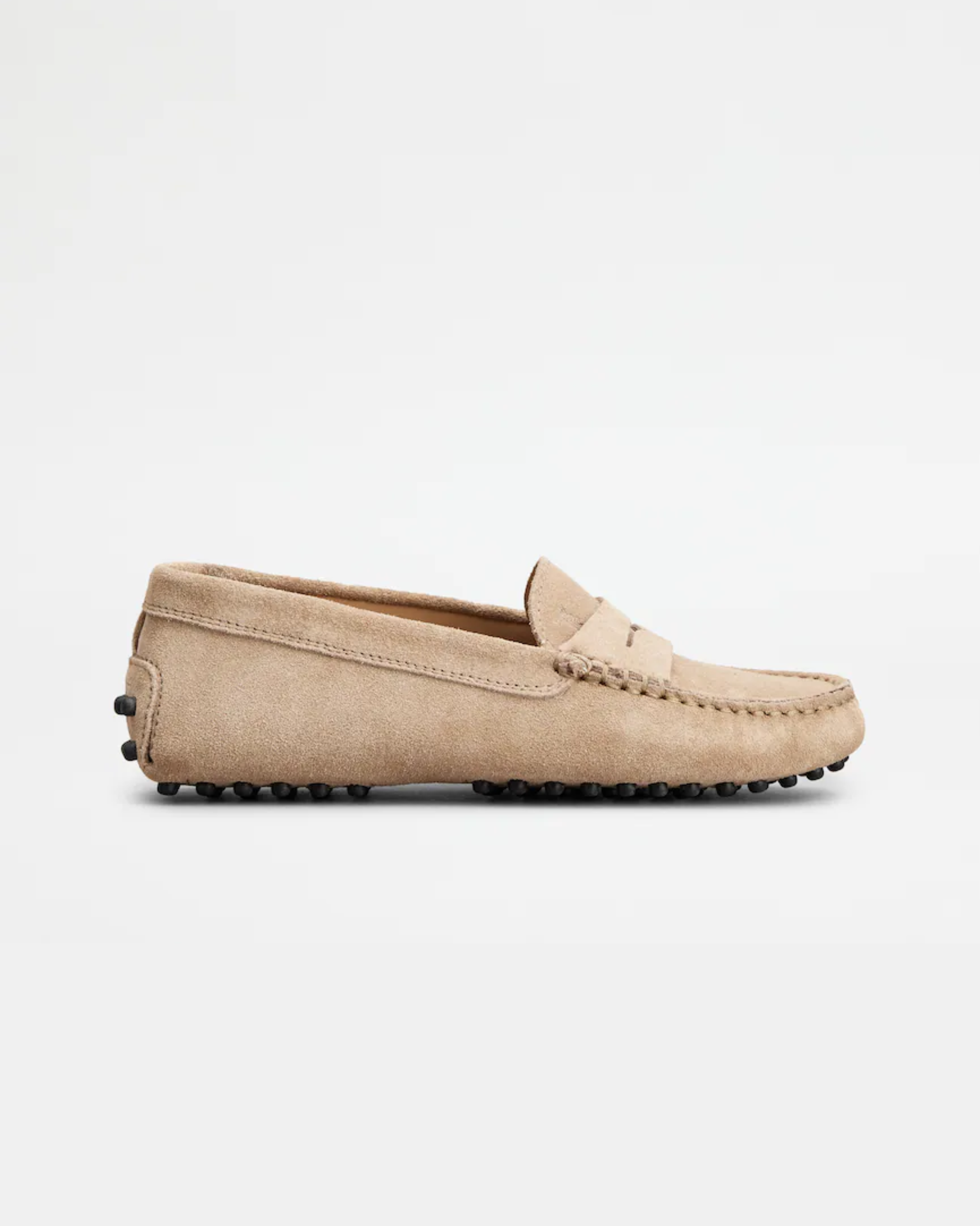 Beige suede junior driving loafer with black rubber sole and stitched detailing — Tod's | Endless UAE