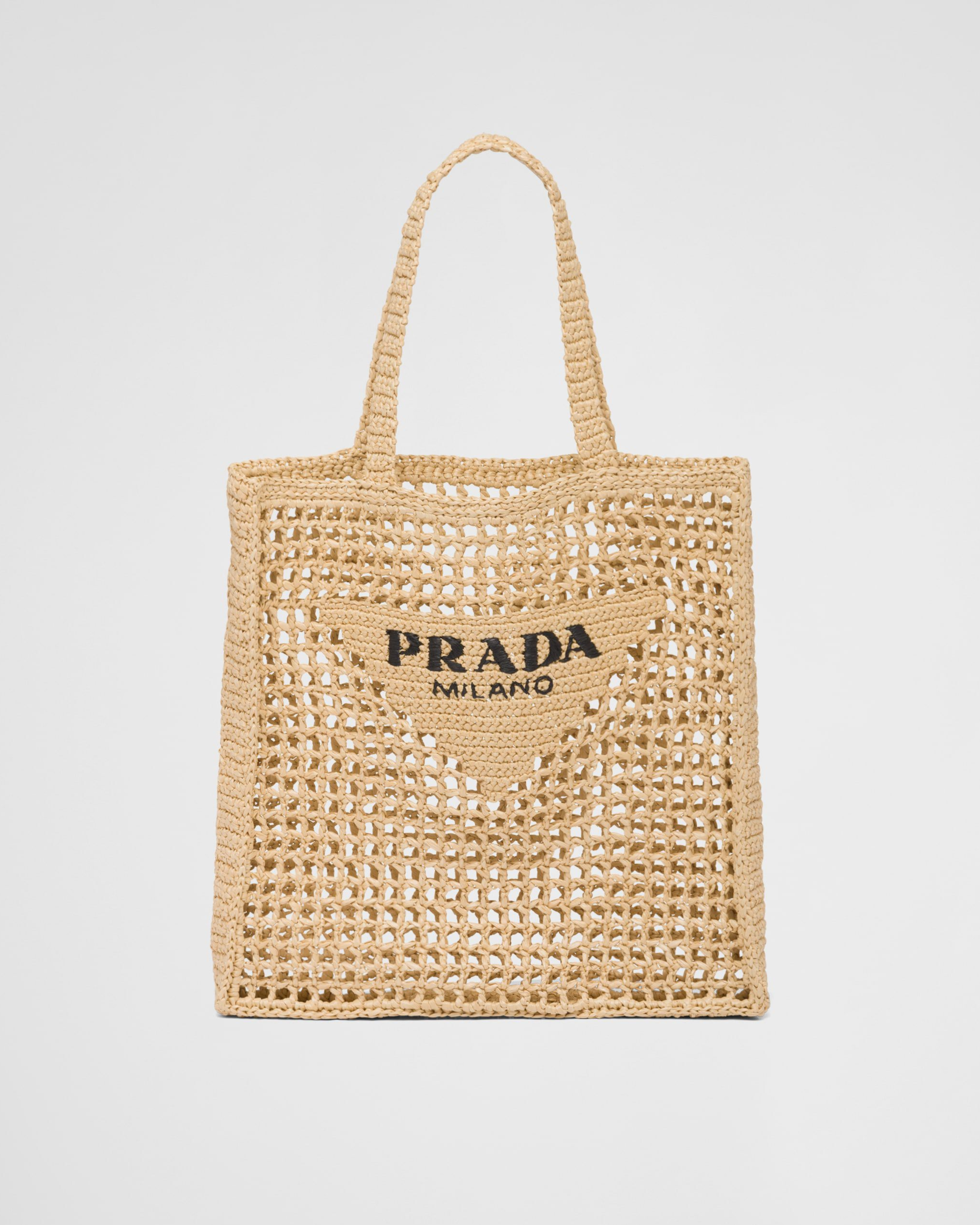 Natural raffia tote bag with open-weave crochet design, triangle logo patch, and braided handles — Prada | Endless UAE
