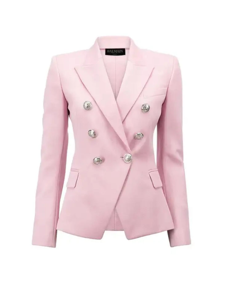 Woman wearing pink double-breasted Balmain blazer with matching skirt and black heels — Balmain | Endless UAE
