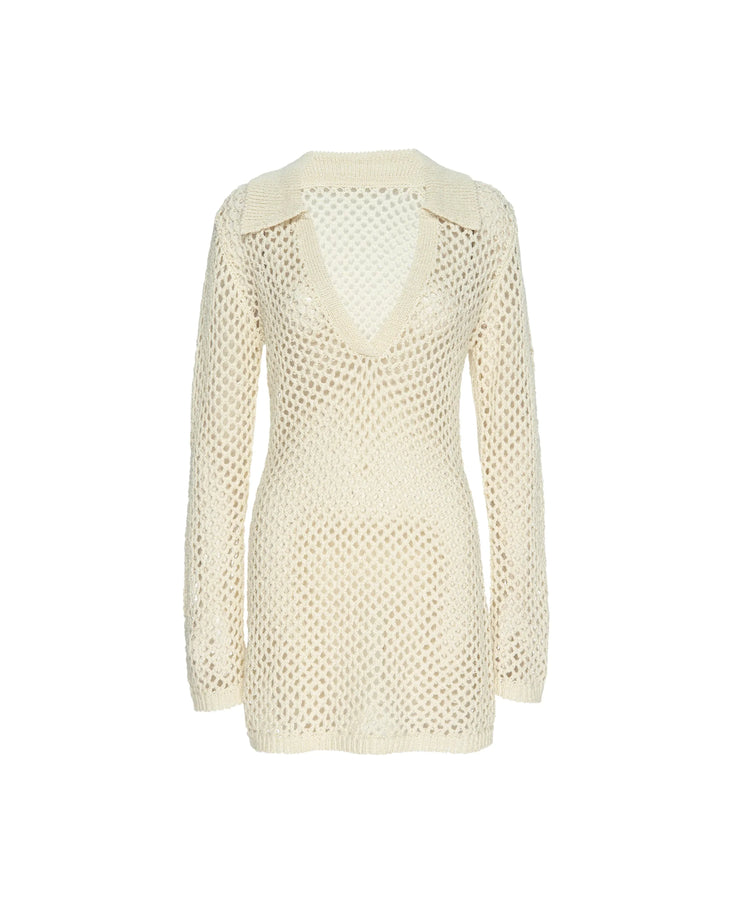 Woman wearing cream knit Newport Dress on beach with arms raised — Monday Swimwear | Endless UAE