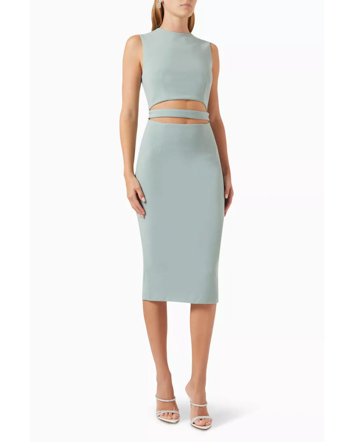 Woman wearing sage green sleeveless cut-out midi dress with white sandals — Elle Zeitoune | Endless UAE