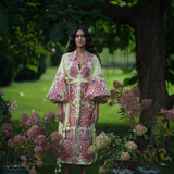 Hoertensia embroidered cotton caftan midi with pink floral pattern and balloon sleeves on model in garden — Yuliya Magdych | Endless UAE