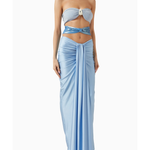 Woman wearing light blue Giselle Maxi Dress with cutout details and white handbag — Baobab | Endless UAE