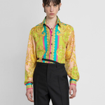 Woman wearing Barocco Goddess silk shirt in yellow with baroque print and colorful placket — Versace | Endless UAE