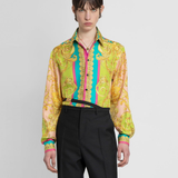 Woman wearing Barocco Goddess silk shirt in yellow with baroque print and colorful placket — Versace | Endless UAE