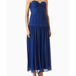 Woman wearing Isola Strapless Ruched Midi Dress in blue with black sandals — Shona Joy | Endless UAE