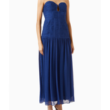 Woman wearing Isola Strapless Ruched Midi Dress in blue with black sandals — Shona Joy | Endless UAE