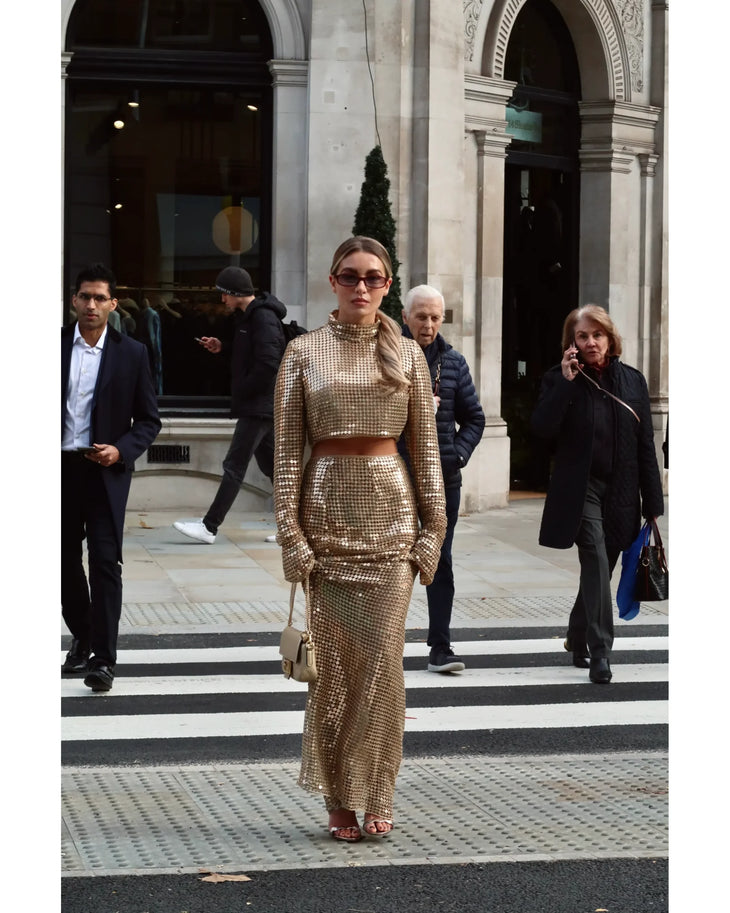 Gold sequined maxi skirt with high waist and cropped top, worn with matching crop top and accessories — Melissa Phair | Endless UAE
