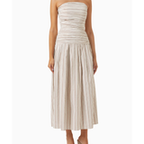 Woman wearing beige and white striped strapless midi dress with pleated skirt — Anna Quan | Endless UAE