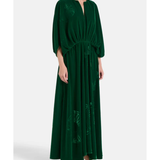 Woman wearing a forest green silk velvet maxi dress with draped sleeves and embroidered details — Themis-Z | Endless UAE