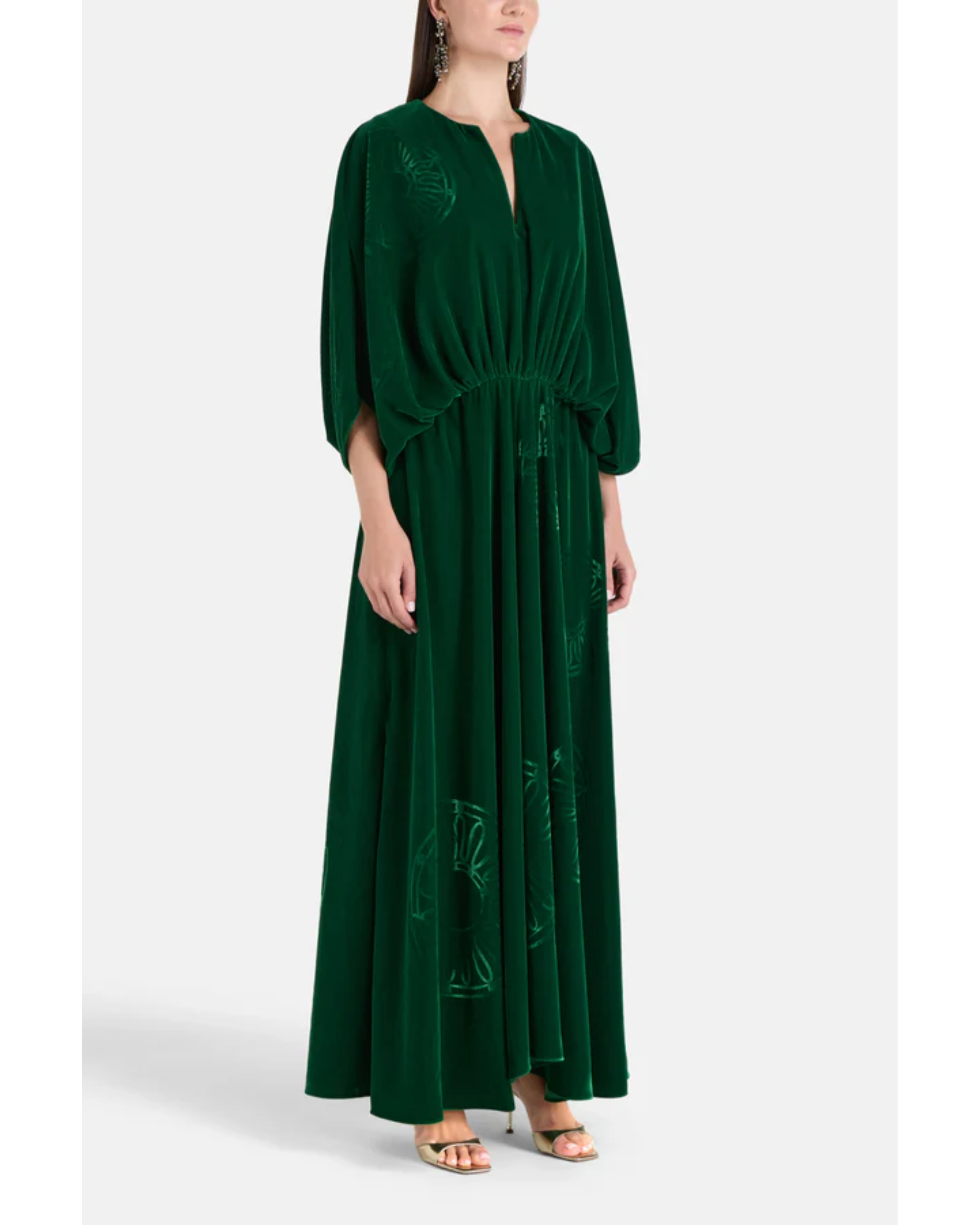 Woman wearing a forest green silk velvet maxi dress with draped sleeves and embroidered details — Themis-Z | Endless UAE