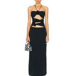 Black maxi dress with cutout waist detail and tie accents, paired with zebra print bag — Mygel Coronel | Endless UAE