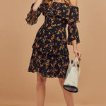 Black floral print off-shoulder mini dress with tiered ruffle layers and bell sleeves — Bardot | Endless UAE