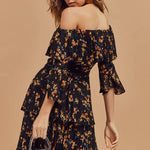 Black floral off-shoulder mini dress with tiered ruffles and bell sleeves, model holding clear handbag — Bardot | Endless UAE